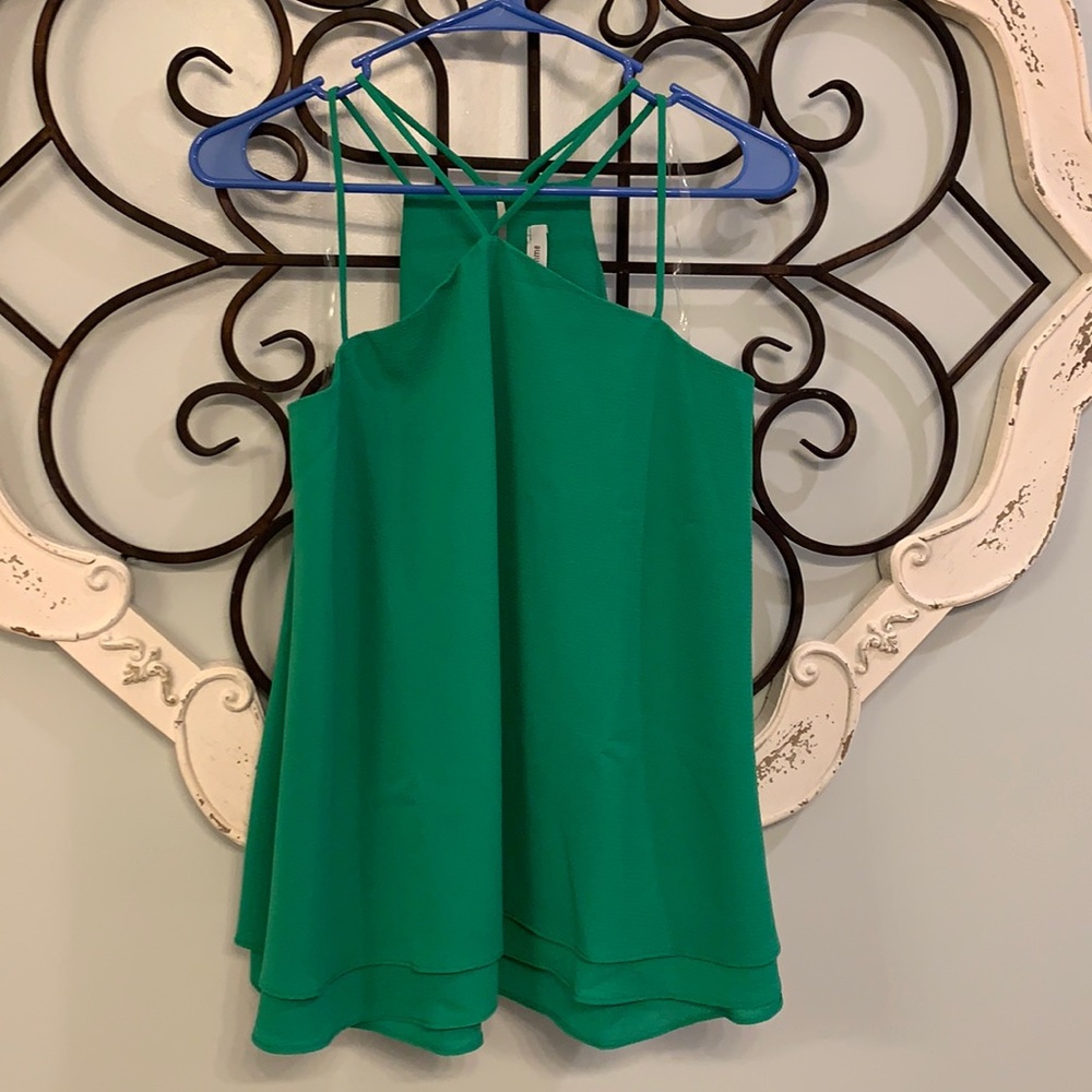Never been worn. Women’s strappy shirt. Super cute